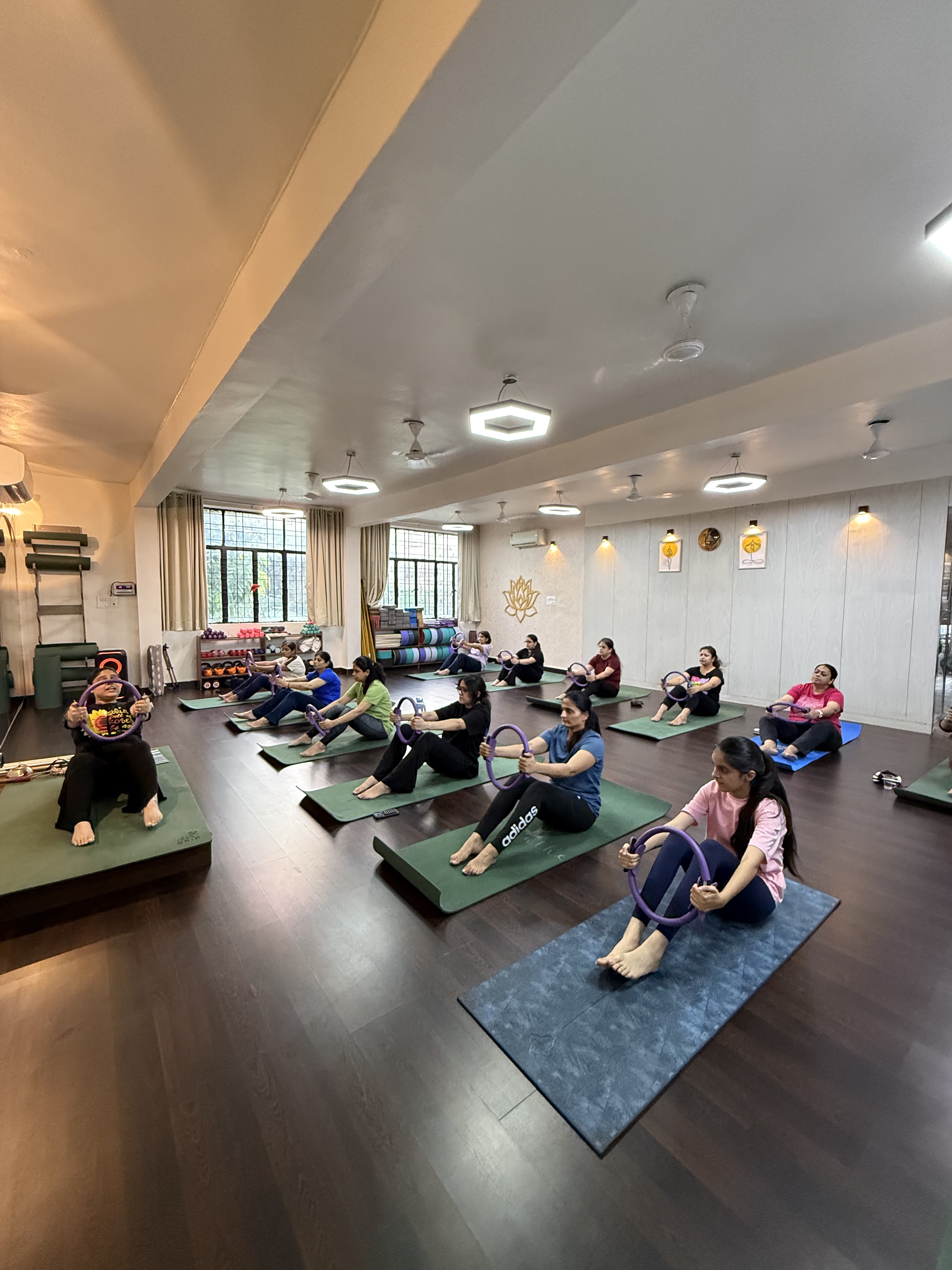A mat Pilates class using rings at Zelosity